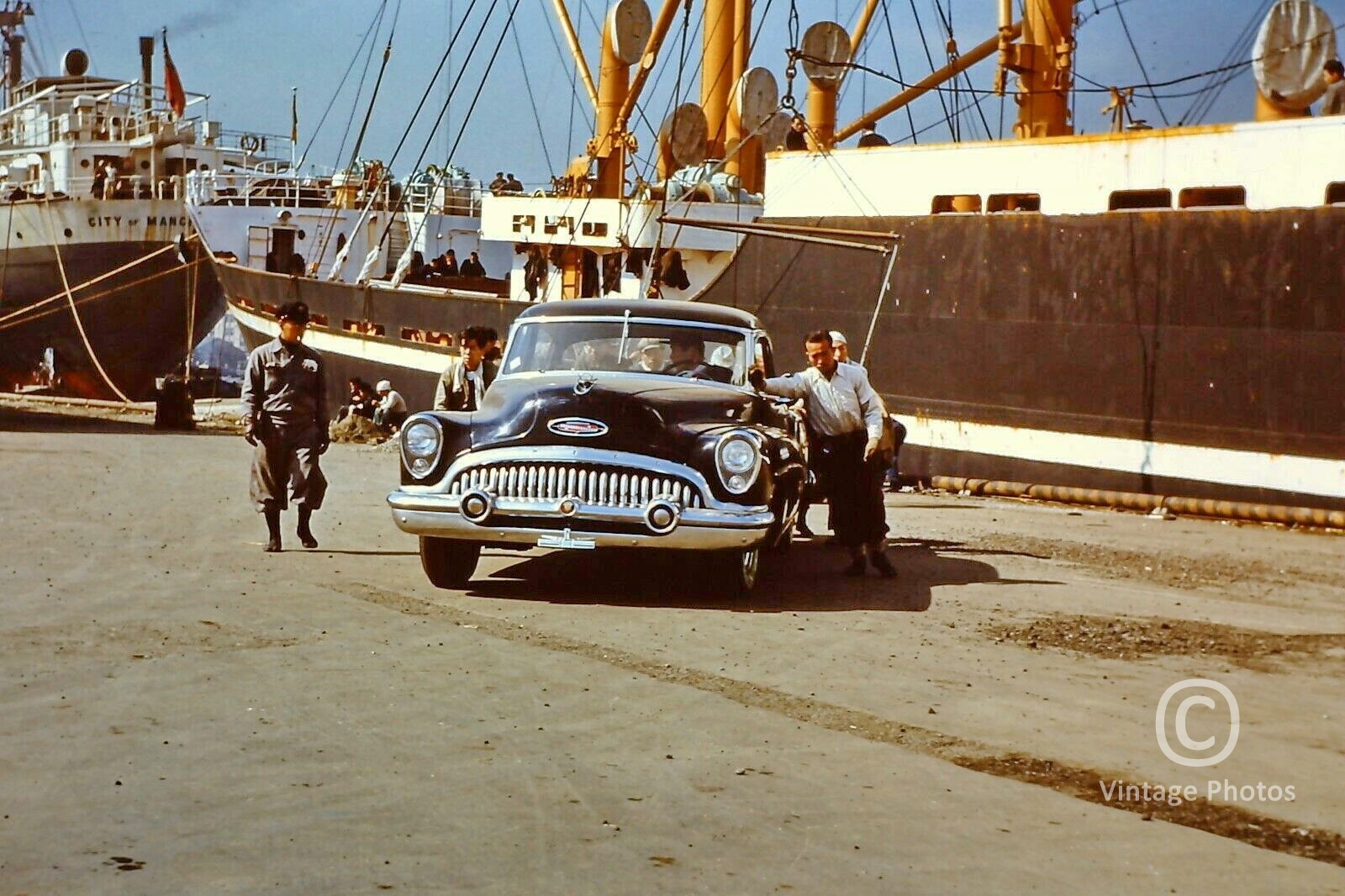 1950s Unloading Classic American automobile in Japanese Port