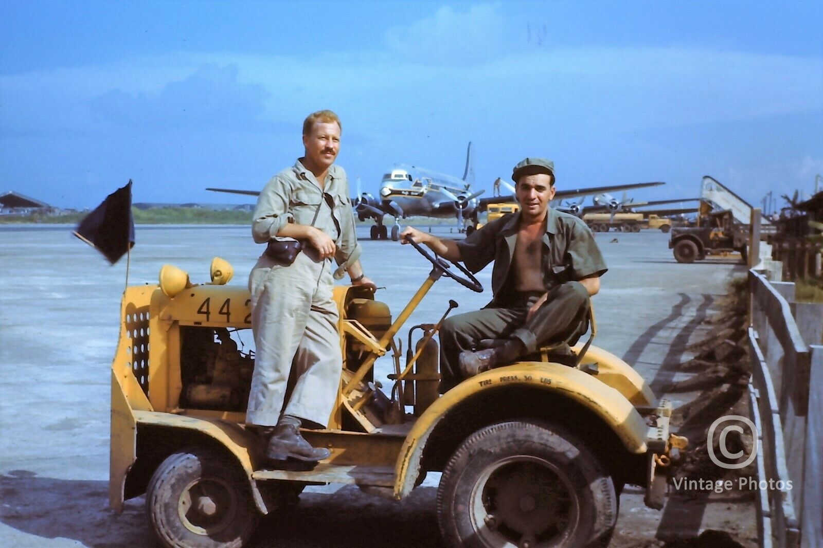 1950s Airport Workers on Equipment with Aircraft in background