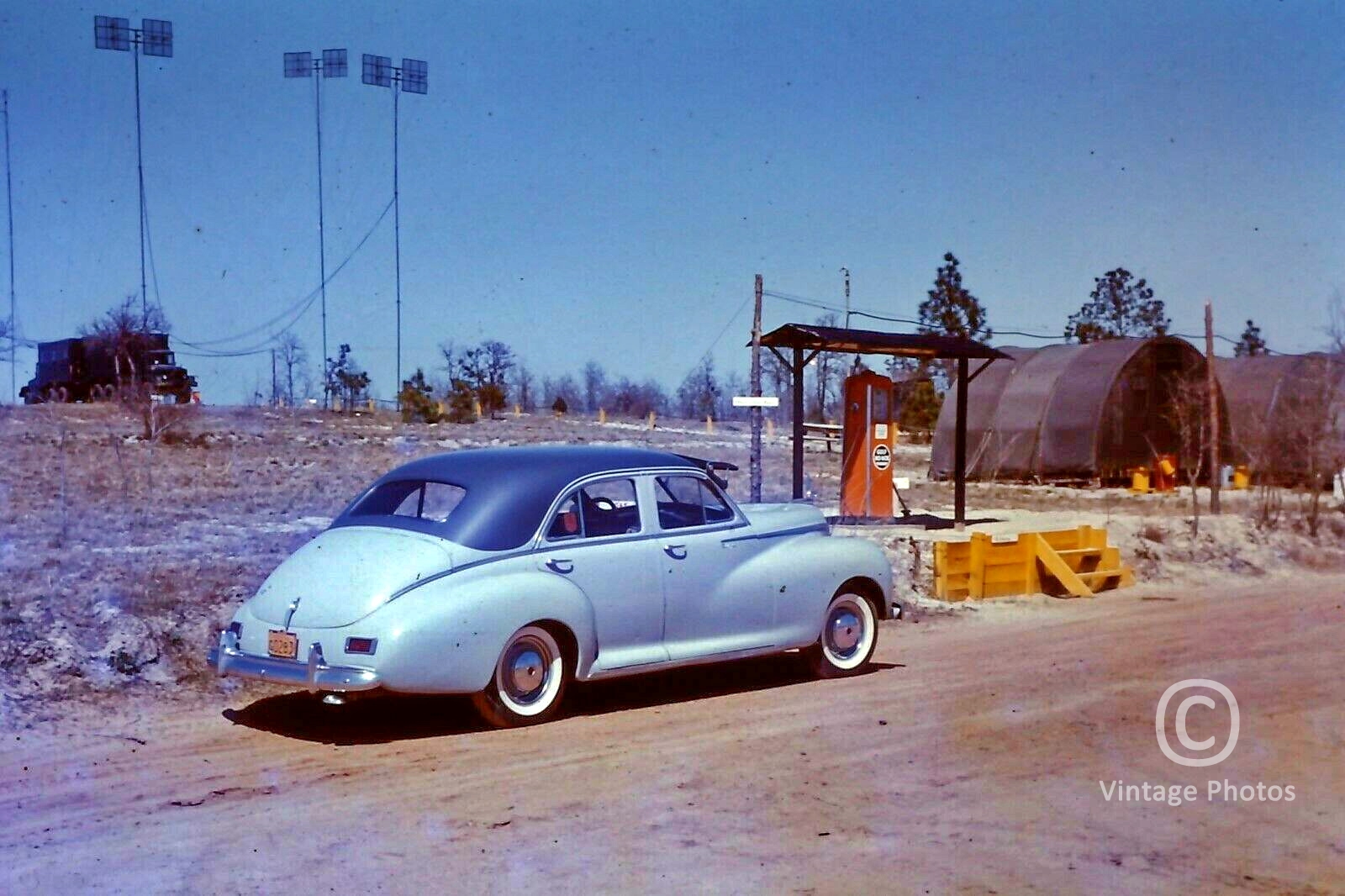 1950s American 2 tone blue Classic Car near Petrol Pump