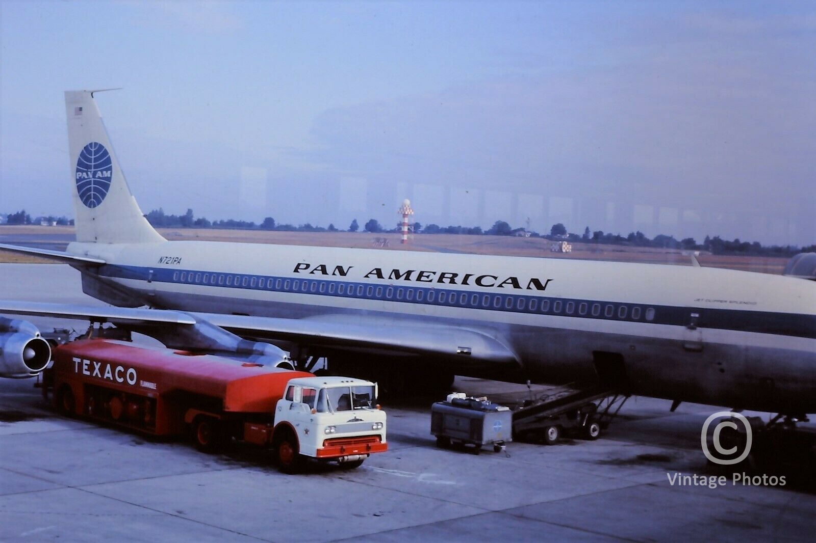 1960s Pan American Boeing 707 N721PA refuelling with Red Texaco Truck June 1965 Seattle