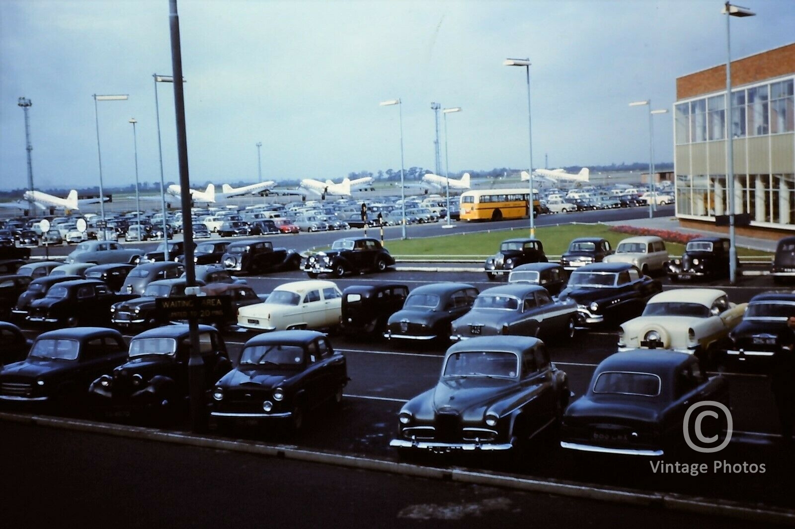 1950s United Kingdom Airport - Many Cars Parked